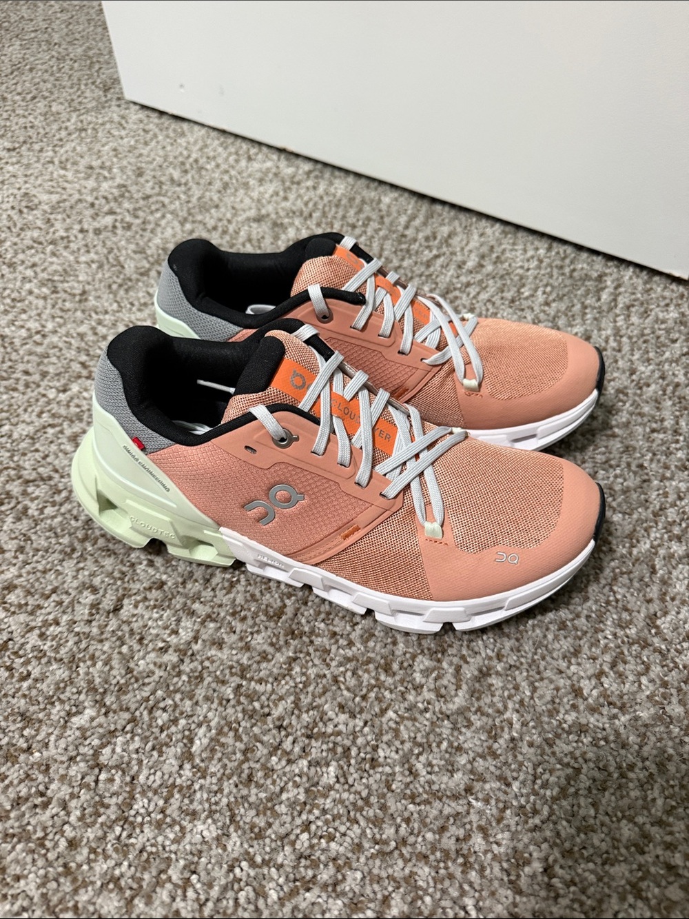On Running Women’s Coral Sneakers with Mint Heel Accents